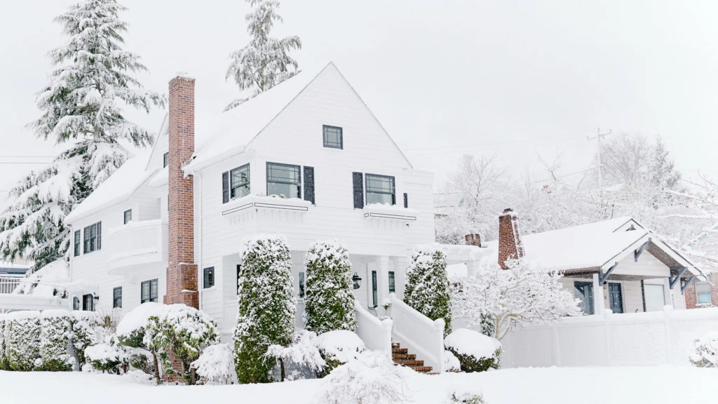 Residential homes covered in winter snow