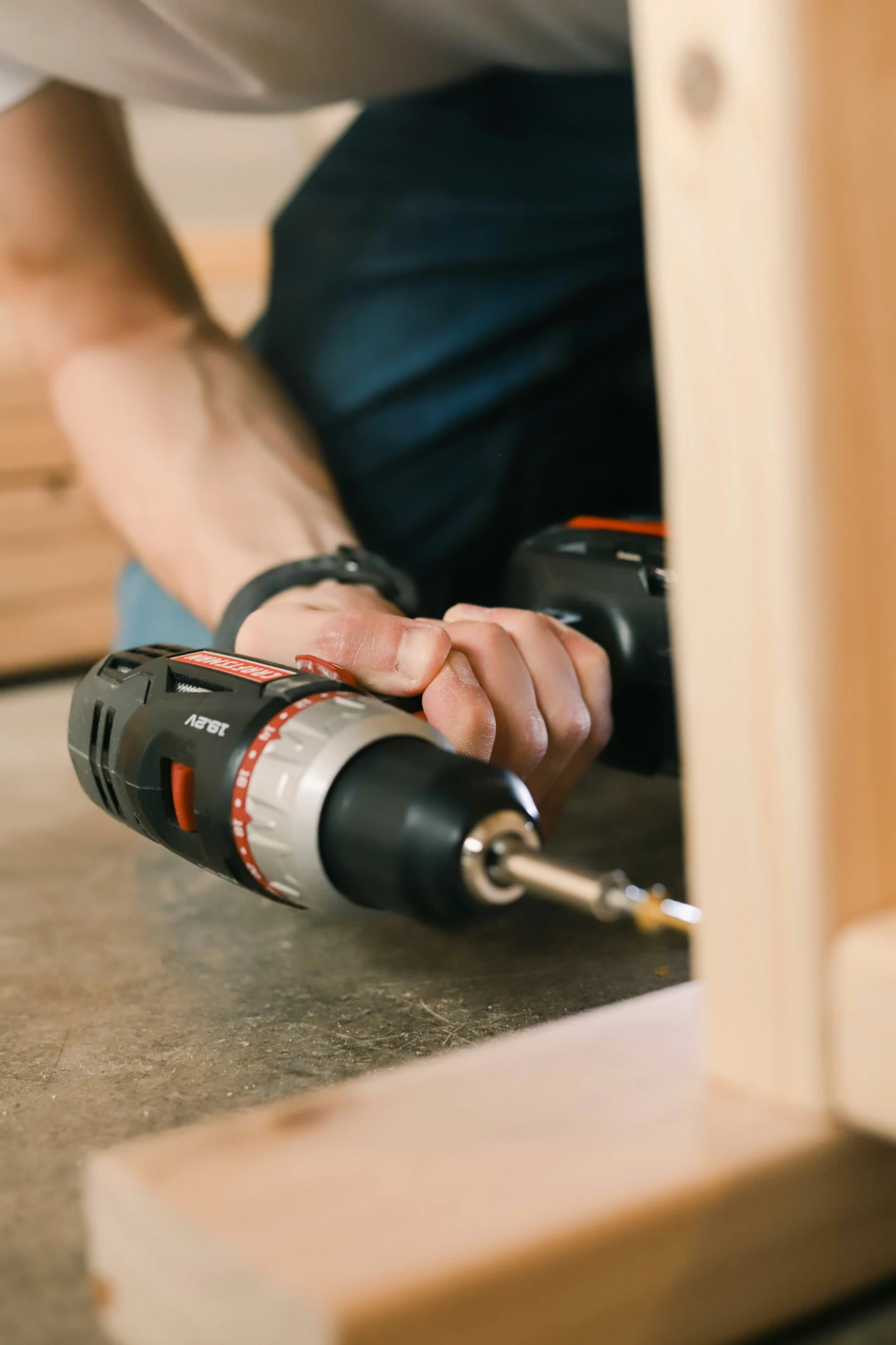 Cordless drill used during furniture assembly