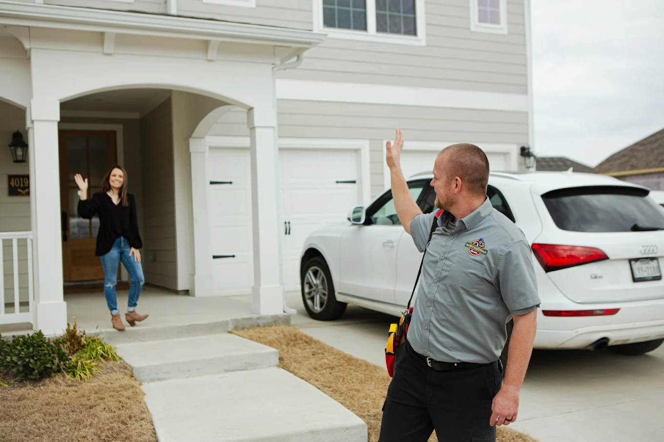 unnamed (45) Hank's technician greeting a homeowner at her front door
