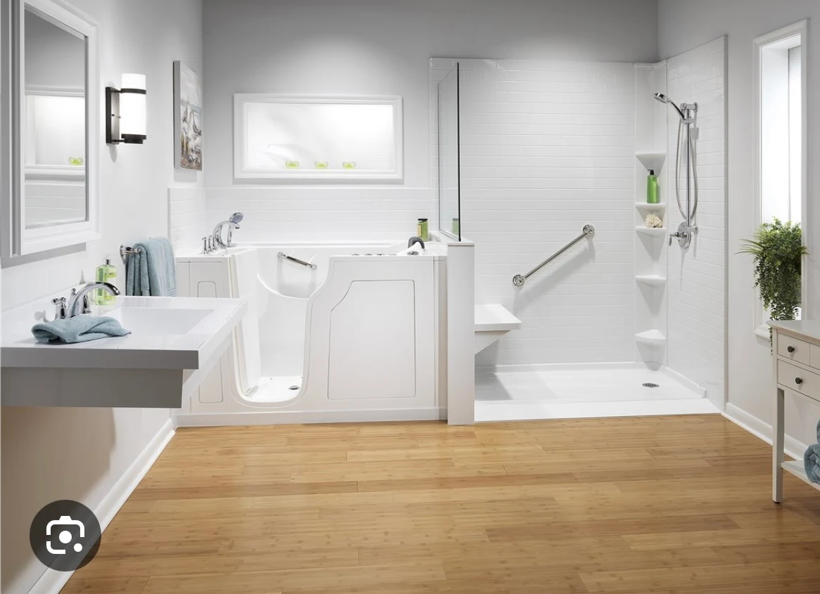 Accessible bathroom with grab bars, a shower seat, and open floor space