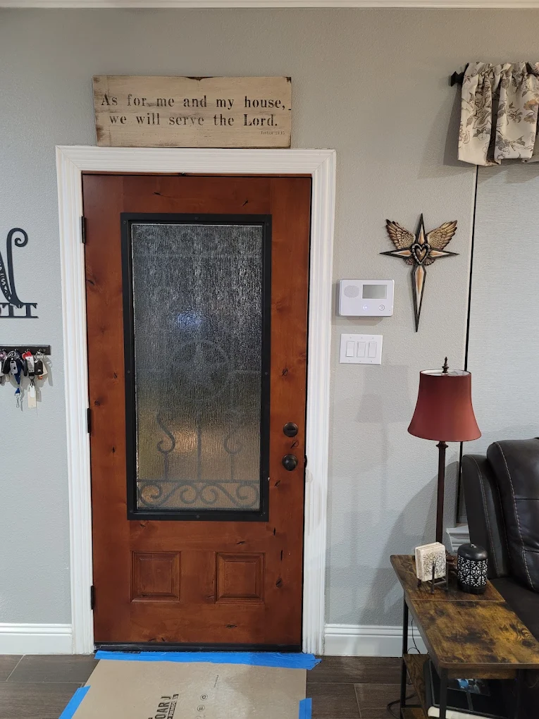 unnamed (50) Wood front door with decorative glass in a finished entryway