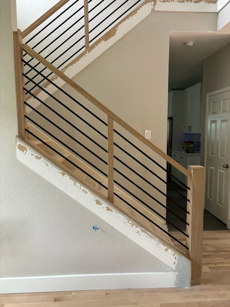 unnamed (60) Updated staircase with wood handrails and black metal balusters