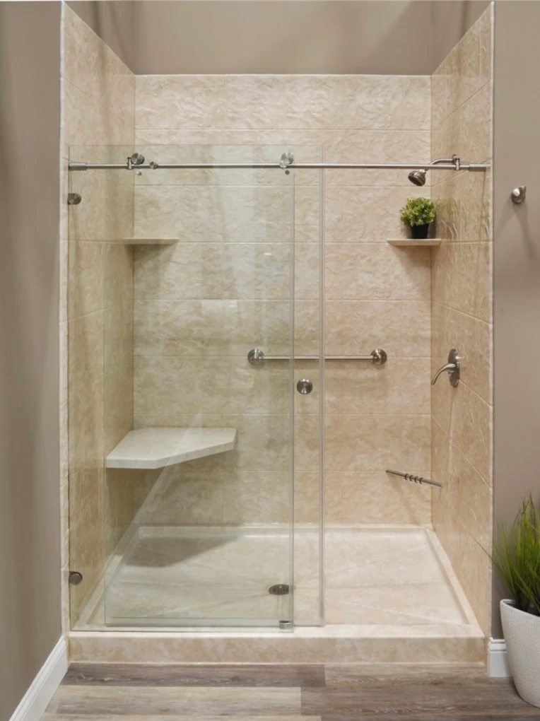 Walk-in shower with frameless glass and beige tile